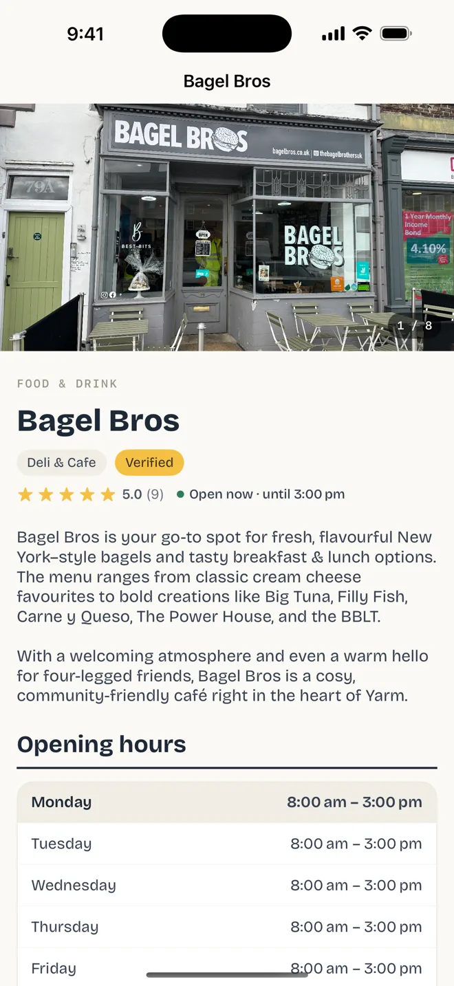 A business page in the app, showing Bagel Bros' photos, rating, description and opening hours.