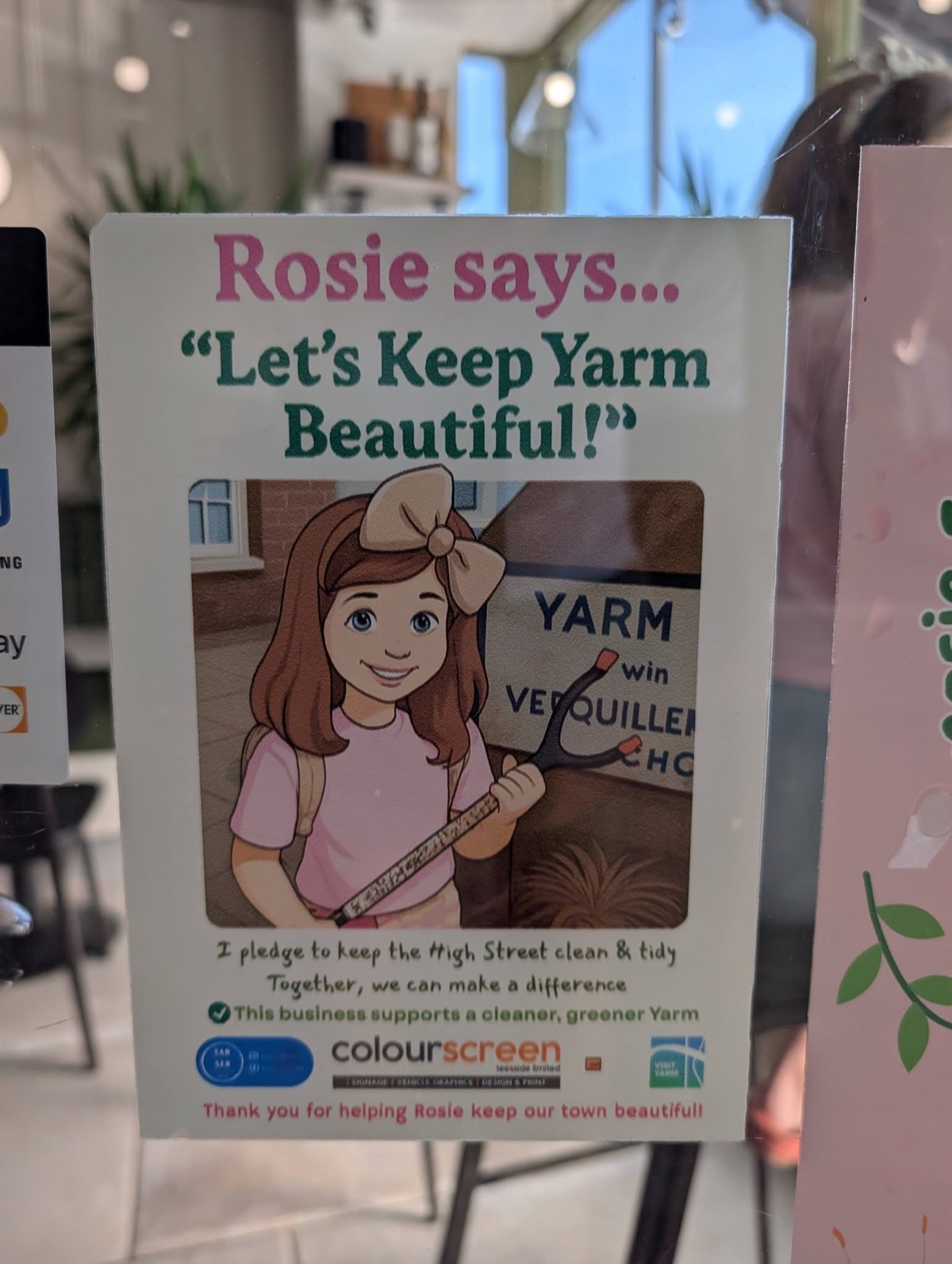 Window poster reading "Rosie says... Let's Keep Yarm Beautiful!" with a pledge to keep the High Street clean and tidy